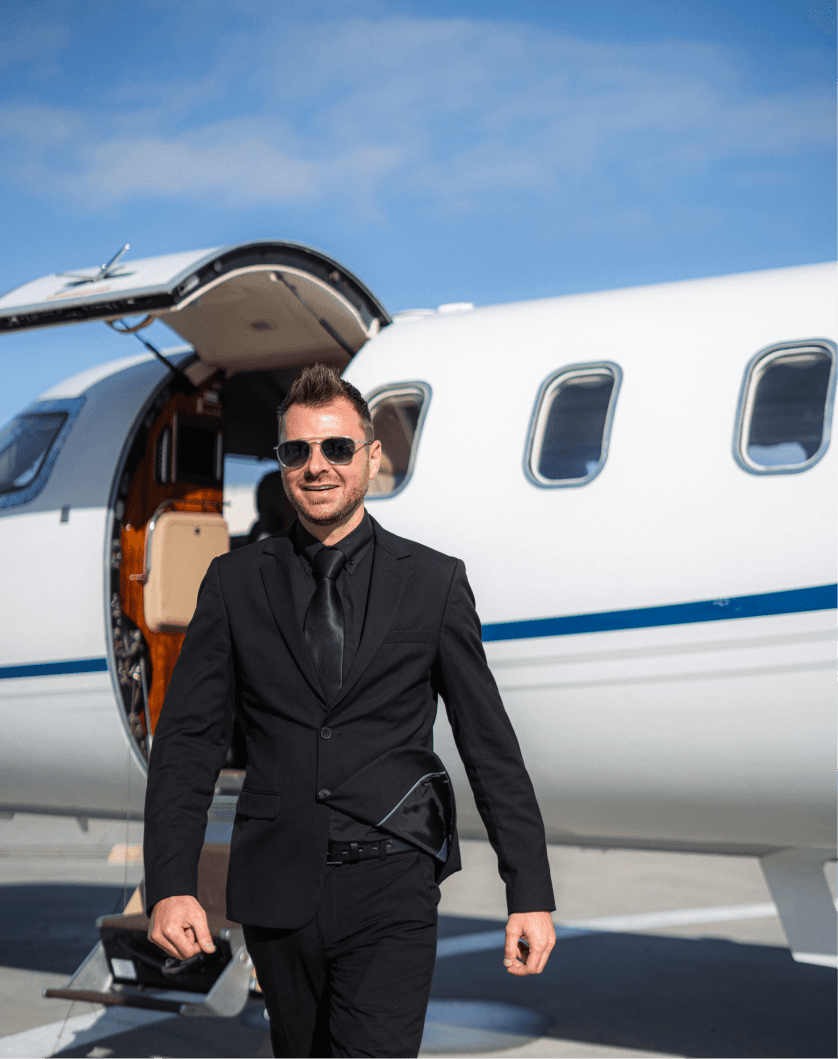 Executive walking toward a private jet